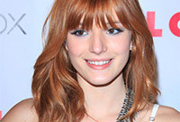 Bella-thorne-blue-eye-makeup-for-red-hair-side